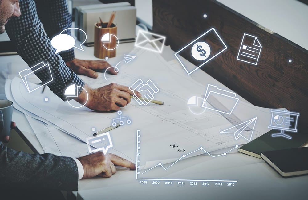 Personnes travaillant sur des plans, entourées d'icônes numériques flottantes.